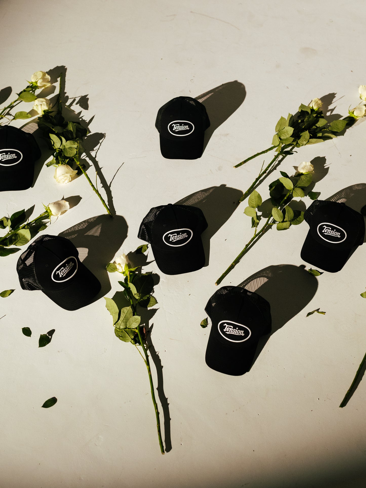 Tension Black Trucker Hat