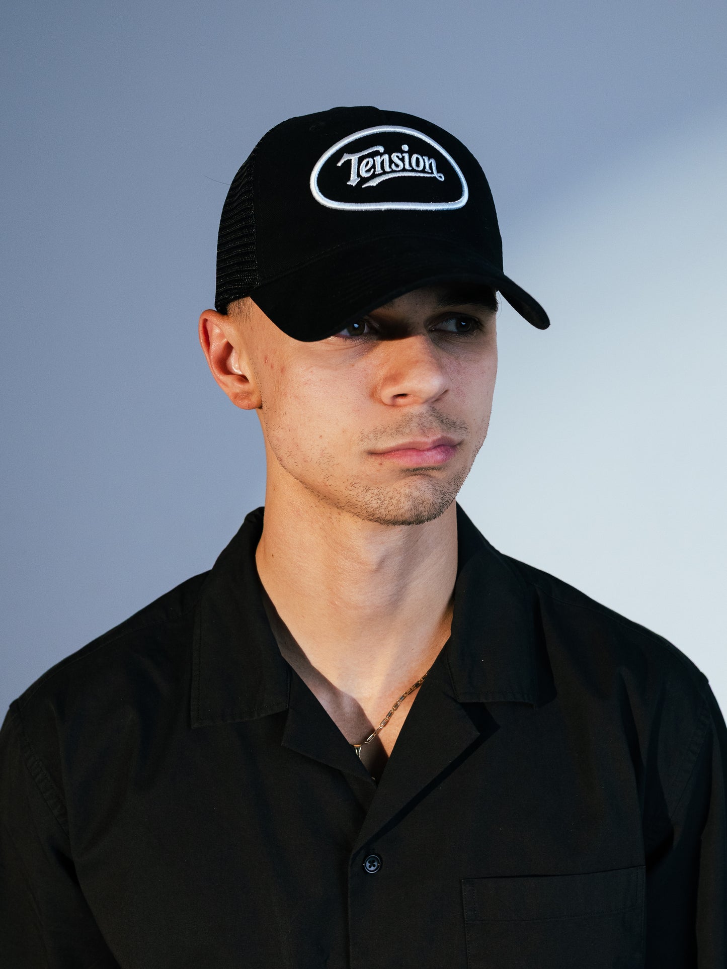 Tension Black Trucker Hat