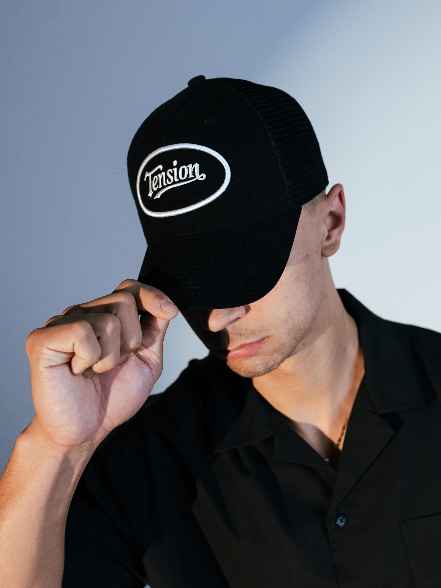 Tension Black Trucker Hat