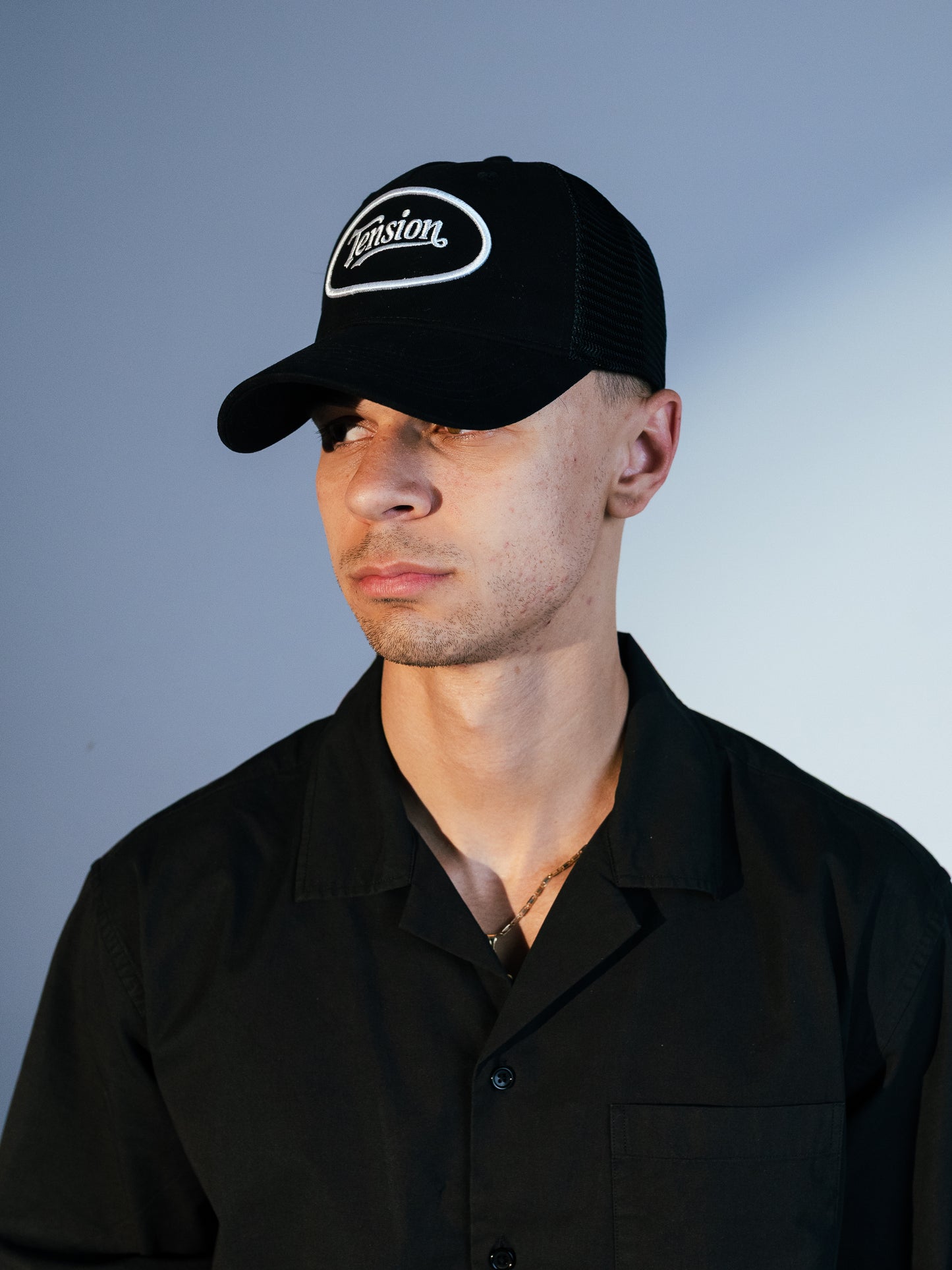 Tension Black Trucker Hat