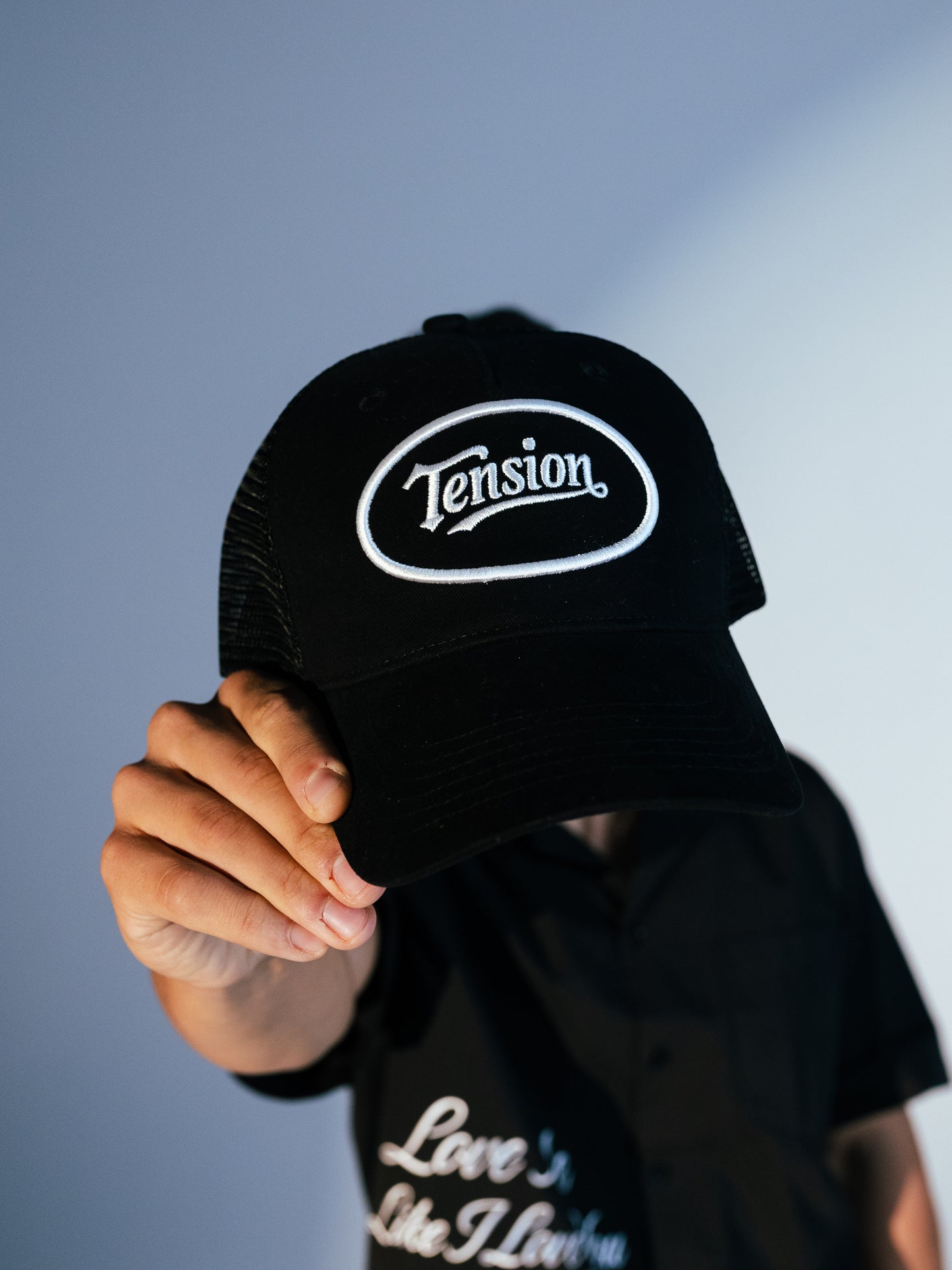 Tension Black Trucker Hat