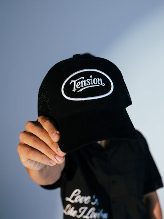 Tension Black Trucker Hat